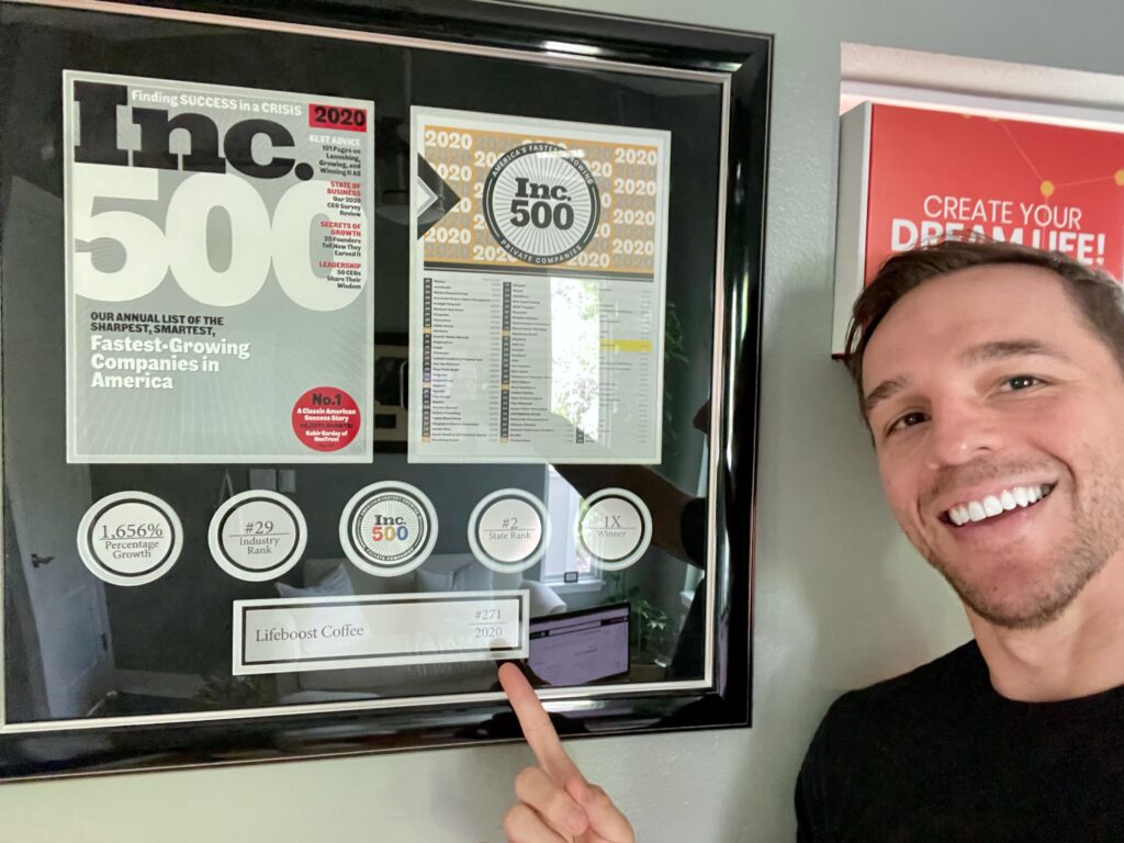 Matt Clark showing Lifeboost Coffee's Inc 500 Award